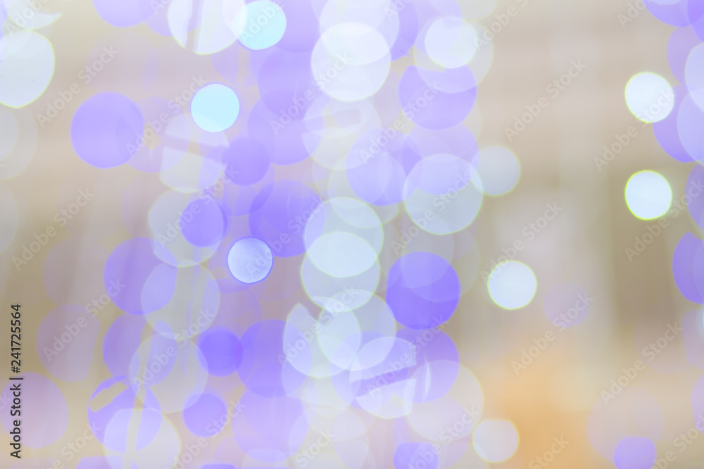 Fototapeta premium Purple glitter lights Defocused Christmas bokeh blur city background in party night light decoration in soft purple white color for greeting card backdrop abstract.