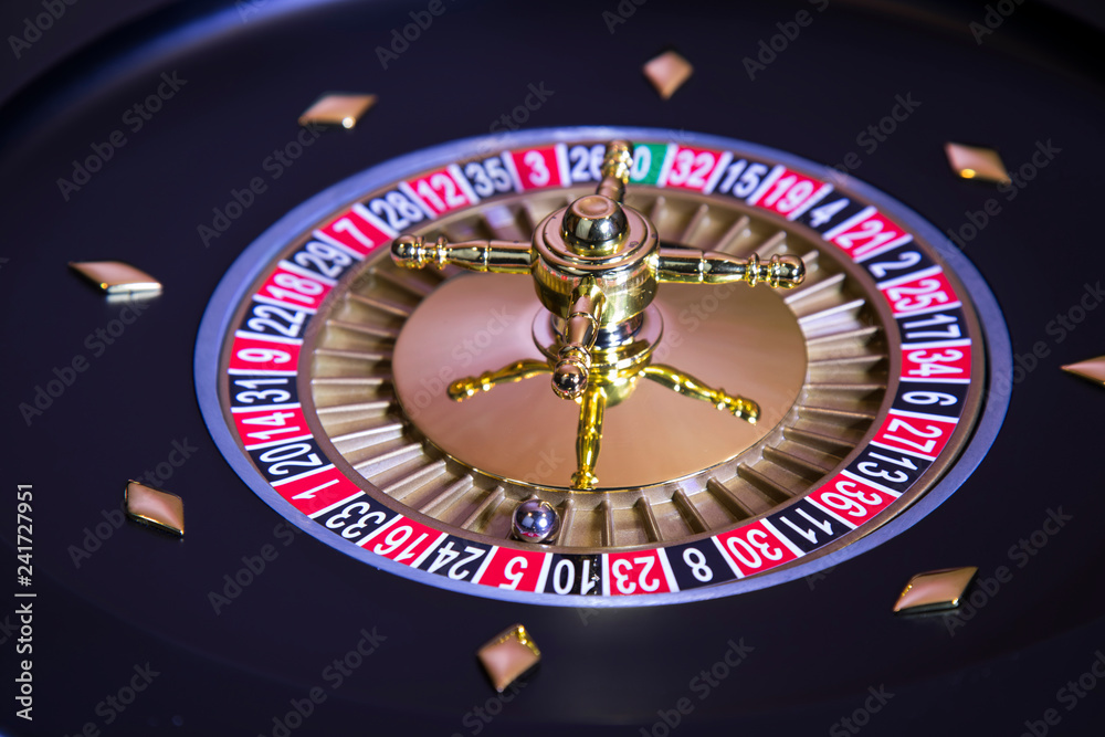 Gaming table, roulette wheel in motion Gaming table, roulette wheel in motion