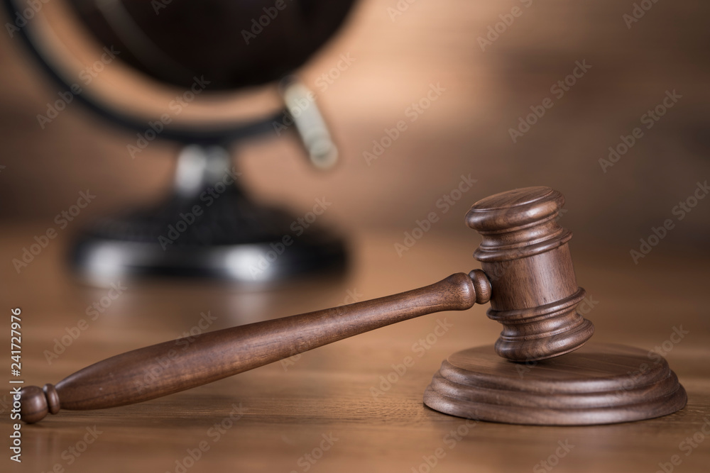 Justice Scale and Gavel globe concept Justice Scale and Gavel globe concept