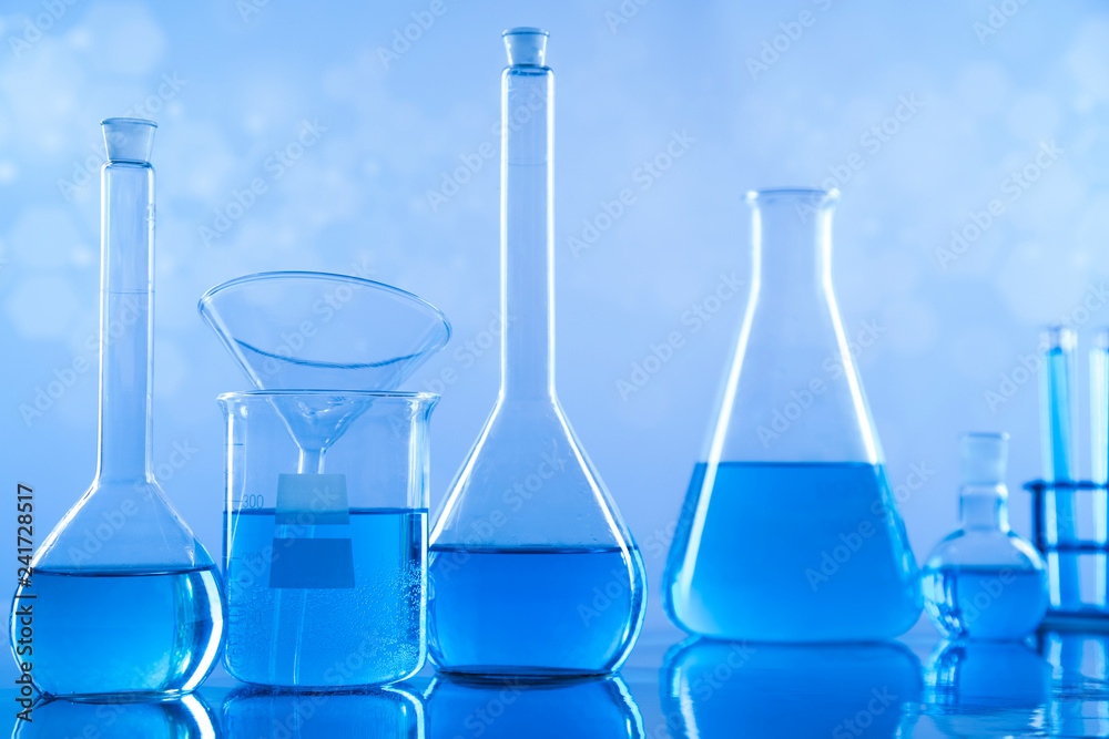 Laboratory beakers,Science experiment, blue background Laboratory beakers,Science experiment, blue background
