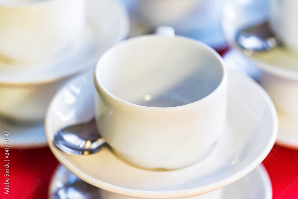 Empy coffee cup with spoon and saucer close Empy coffee cup with spoon and saucer close