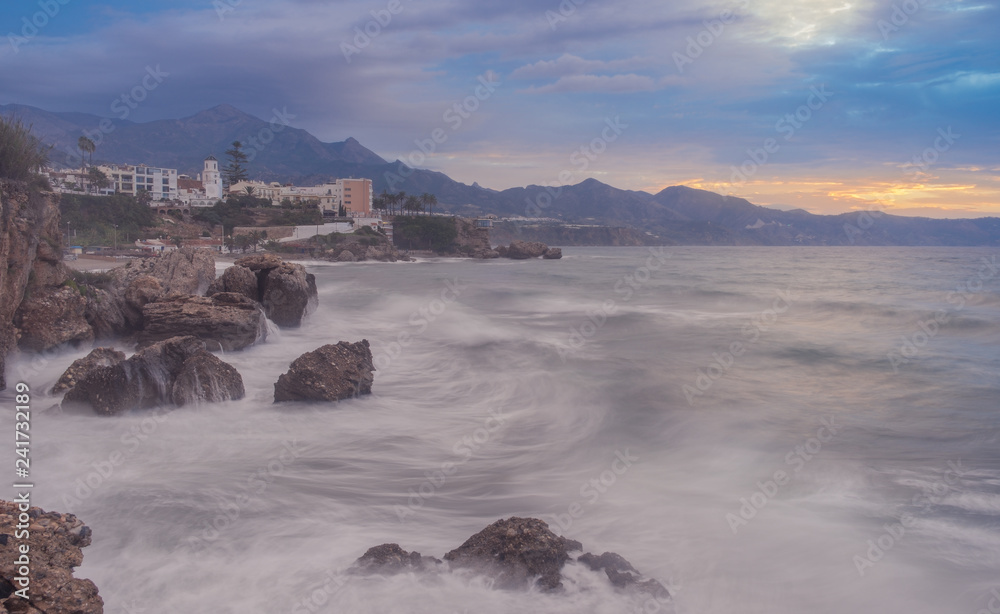 Nerja, Malaga, Andalusi, Spain - November 18, 2018: Sunrise on a stormy day in the well-known Balcon de Europa on the coast of Malaga, Spain