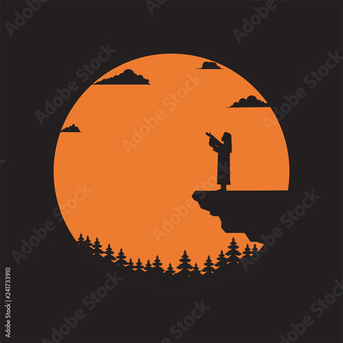 Silhouette pastor standing on cliff