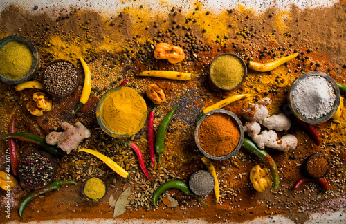 Assortment of spices in wooden bowl background © Sebastian Duda
