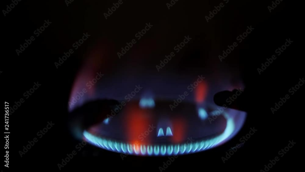 Stove Burner Fire Ignition. Blue Cooking Flame 4K Macro Slow Motion Footage.