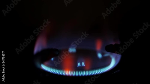 Stove Burner Fire Ignition. Blue Cooking Flame 4K Macro Slow Motion Footage.