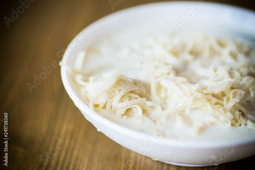homemade sweet noodles with milk in a plate