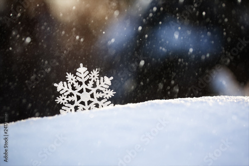 Snowflake on snow.Winter holidays and Christmas background. © Volha Zaitsava