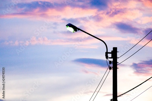 street light lamp in countryside at evening time