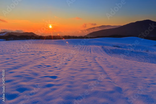Frosty sunset in the mountains in winter