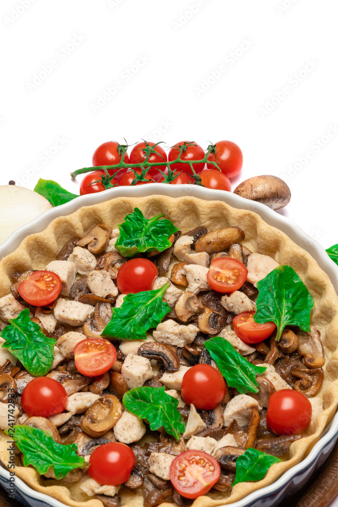 Traditional quiche tart in baking form with filling Traditional quiche tart in baking form with filling