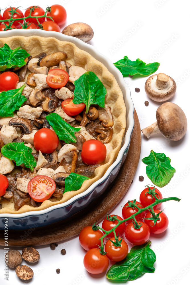 Traditional quiche tart in baking form with filling Traditional quiche tart in baking form with filling