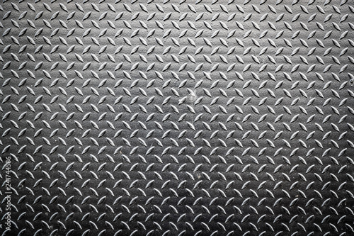 Dark metal floor plate pattern texture background