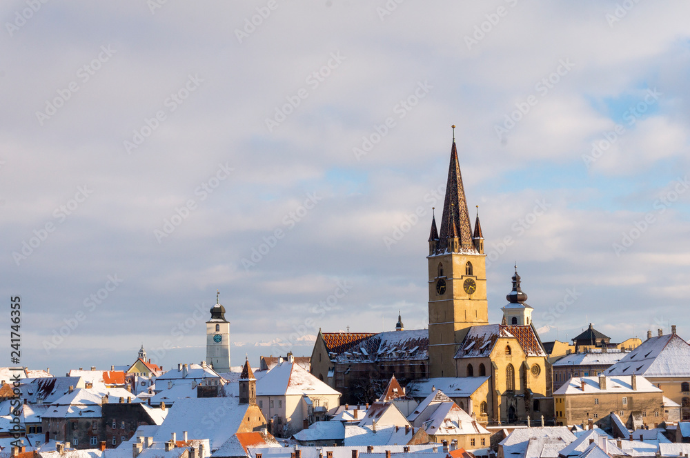 Panoramic view of Sibiu historic center in Transylvania, Romania with The Lutheran Cathedral of Saint Mary. City also known as Hermannstadt Panoramic view of Sibiu historic center in Transylvania, Romania with The Lutheran Cathedral of Saint Mary. City also known as Hermannstadt