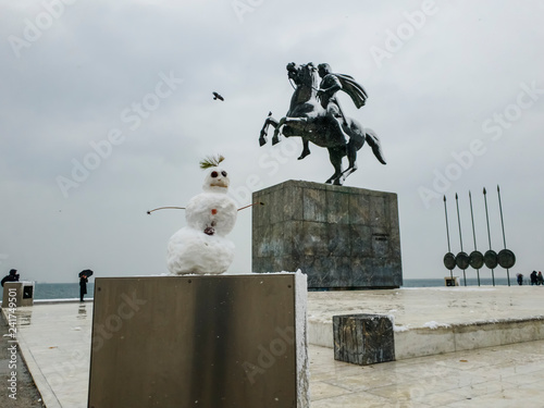 Thessaloniki, Greece heavy snowfall at the city center.A snowman before the statue of Alexander the Great at the city waterfront.