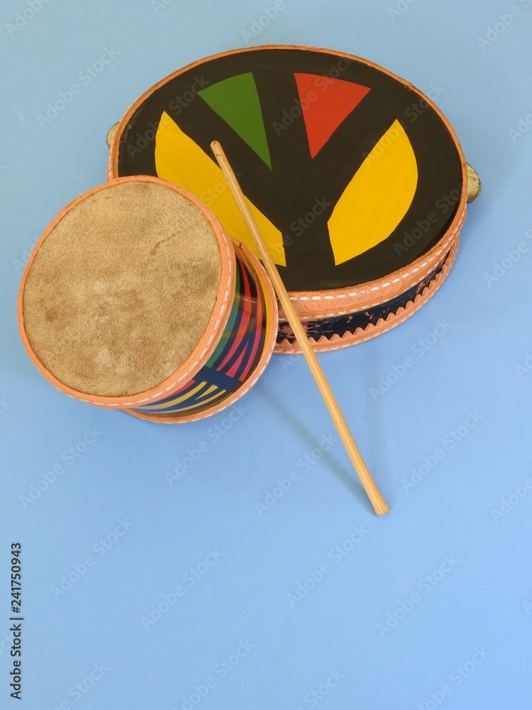 Two colorful handmade Brazilian percussion instruments: pandeiro (tambourine)  and a small drum with drumstick. They are used to play samba and at  carnival. Stock Photo | Adobe Stock