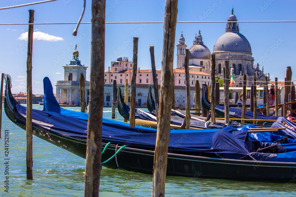 Gondola boats in Venice Italy with view of Basilica Santa Maria della Salute