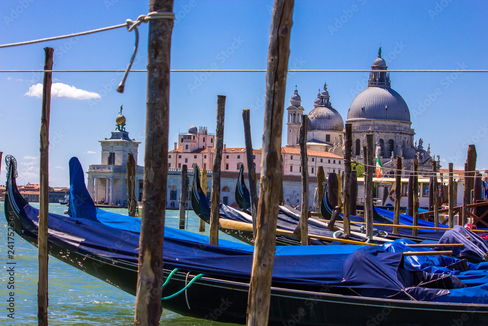 Gondola boats in Venice Italy with view of Basilica Santa Maria della Salute