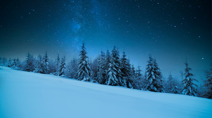 Tatras Mountains in winter at night with falling stars, Poland