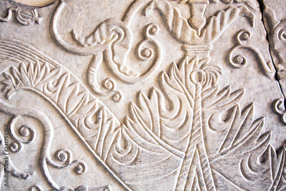 Ancient floral carved marble texture background.