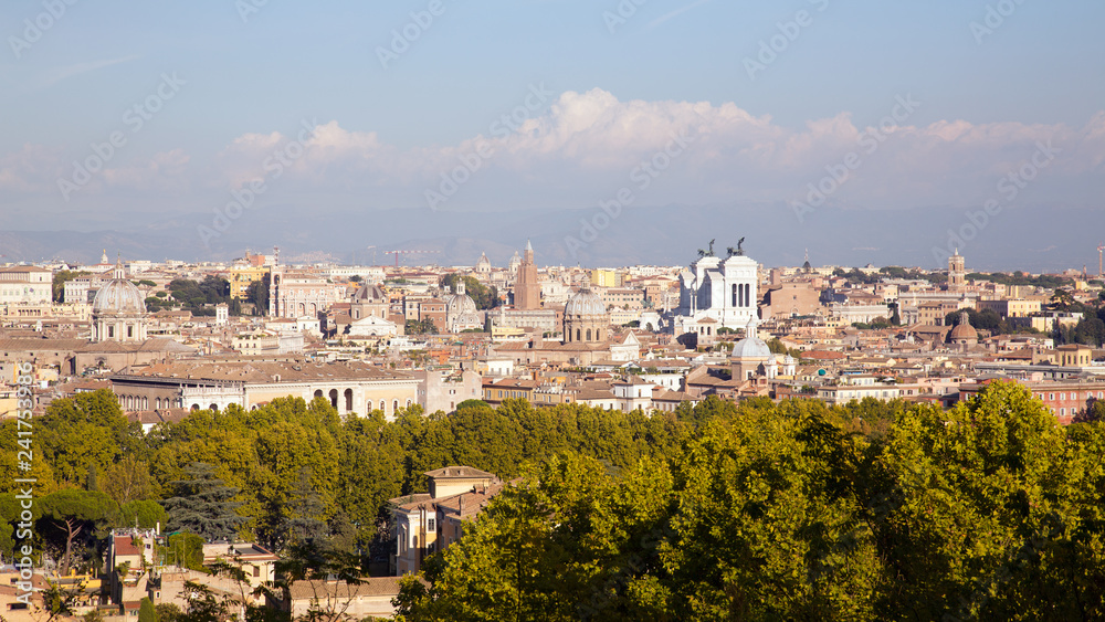 View over Rome bathing in autumn sun seen from the Janiculum hill west of the city. With landmarks as the Pantheon and the Vittorio Emanuele II monument. 