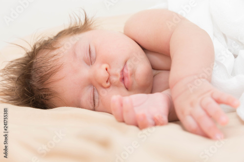 Sleeping newborn caucasian baby