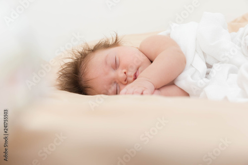 Sleeping newborn caucasian baby