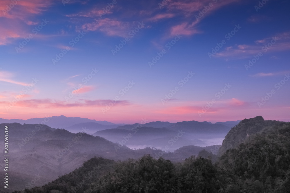 sunrise at Ban Ja Bo, mountain view misty morning above hill tribes village and top mountain around with sea of mist with colorful vivid sky background, Ban jabo village, Mae Hong Son, Thailand.
