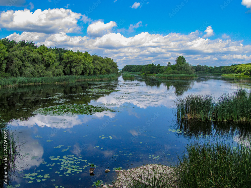 Views of Hungarian nature reserve Kis Balaton (Little Balaton)in the near from Lake Balaton with blue Sky ,green Vegetation and blue Water