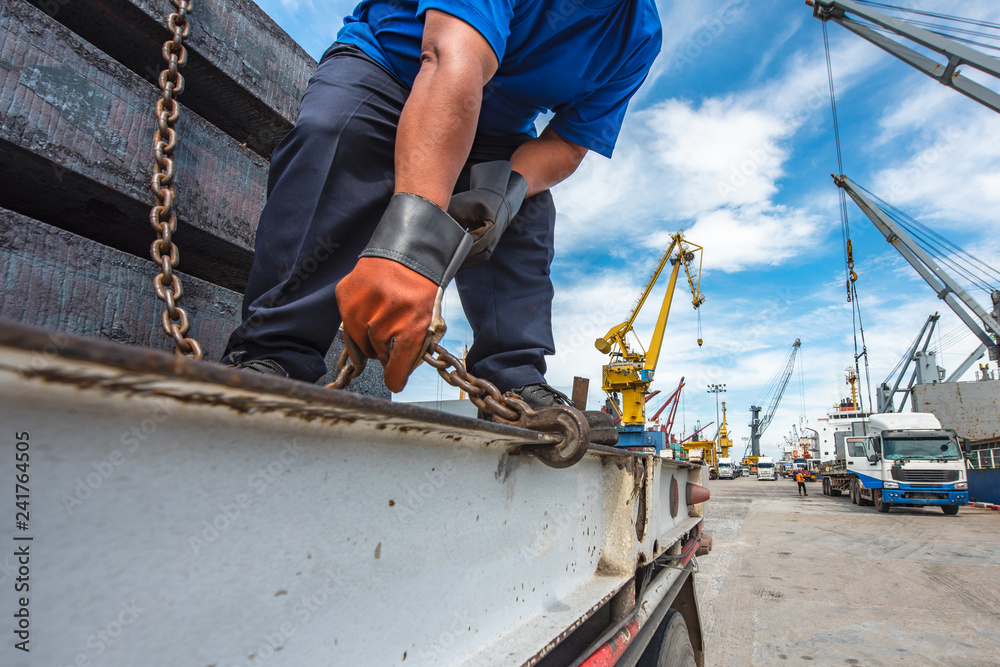 lashing and securing cargo on the trailer prior transportdelivery to the destination for safety, working in port by the gang of stevedore labor