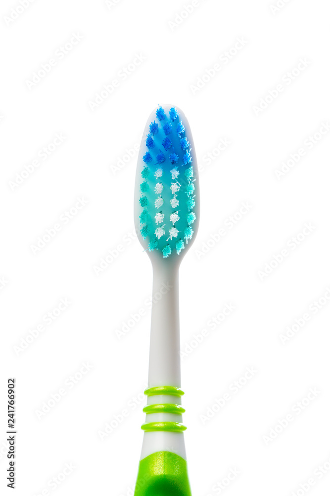 colored toothbrush on an isolated background, close up colored toothbrush on an isolated background, close up