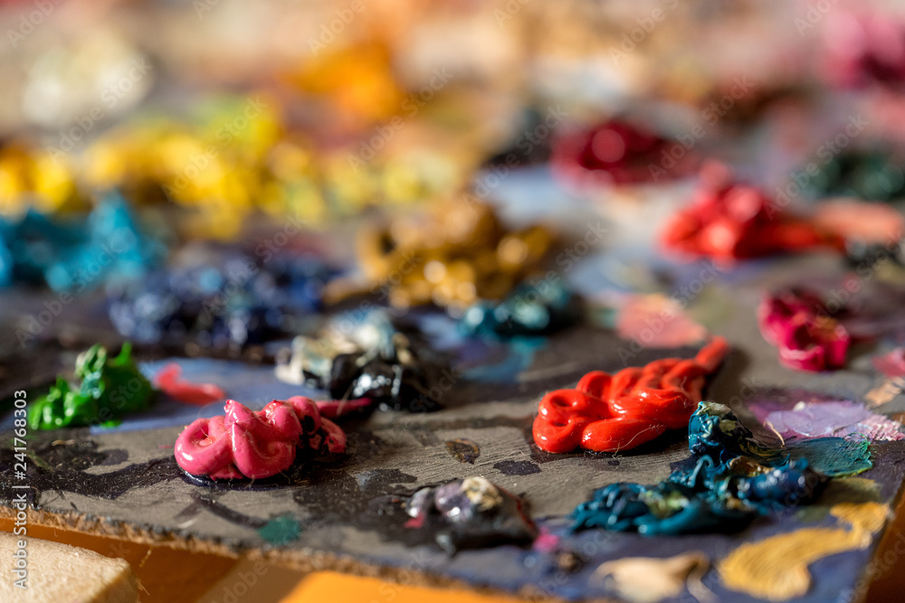 Closeup oil paints on wooden palette Closeup oil paints on wooden palette