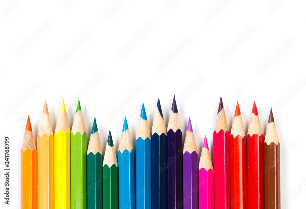 Colour pencils on white background, top view. Colour pencils on white background, top view.