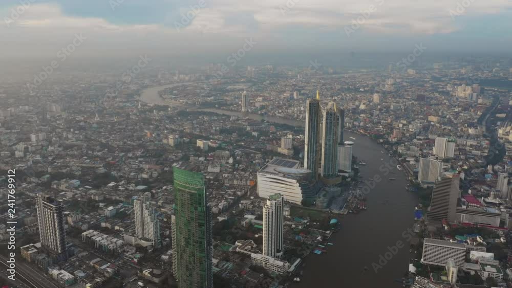 Fly over business center of Bangkok, Sathon thaksin bridge chaophraya river scene Fly over business center of Bangkok, Sathon thaksin bridge chaophraya river scene