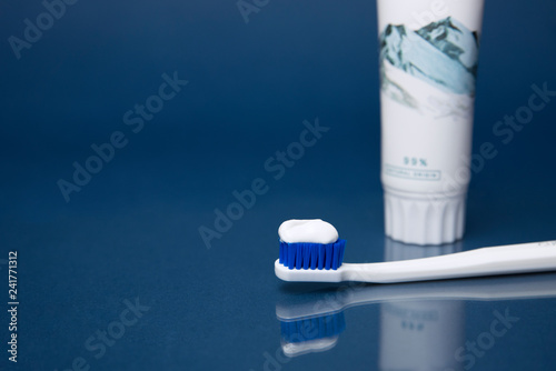 Colorful toothbrushes on a dark background