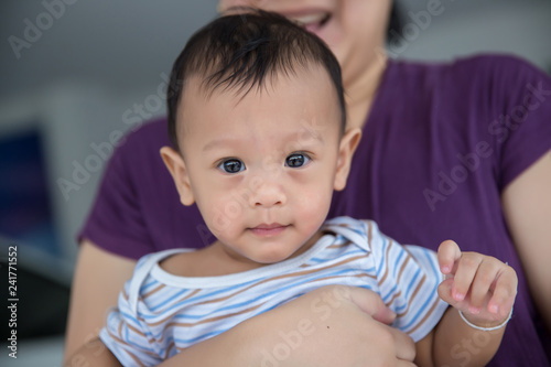 Close up face Baby boy . lovely baby and daddy. family relationship. parents in raising a baby. baby care. image for background  wallpaper  copy space  fashion and article.