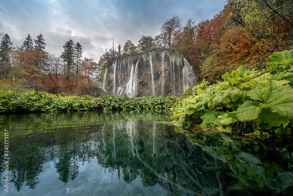 Plitvice Lakes. National Park of Croatia characterized by many waterfalls. In autumn the leaves of the trees are colored red