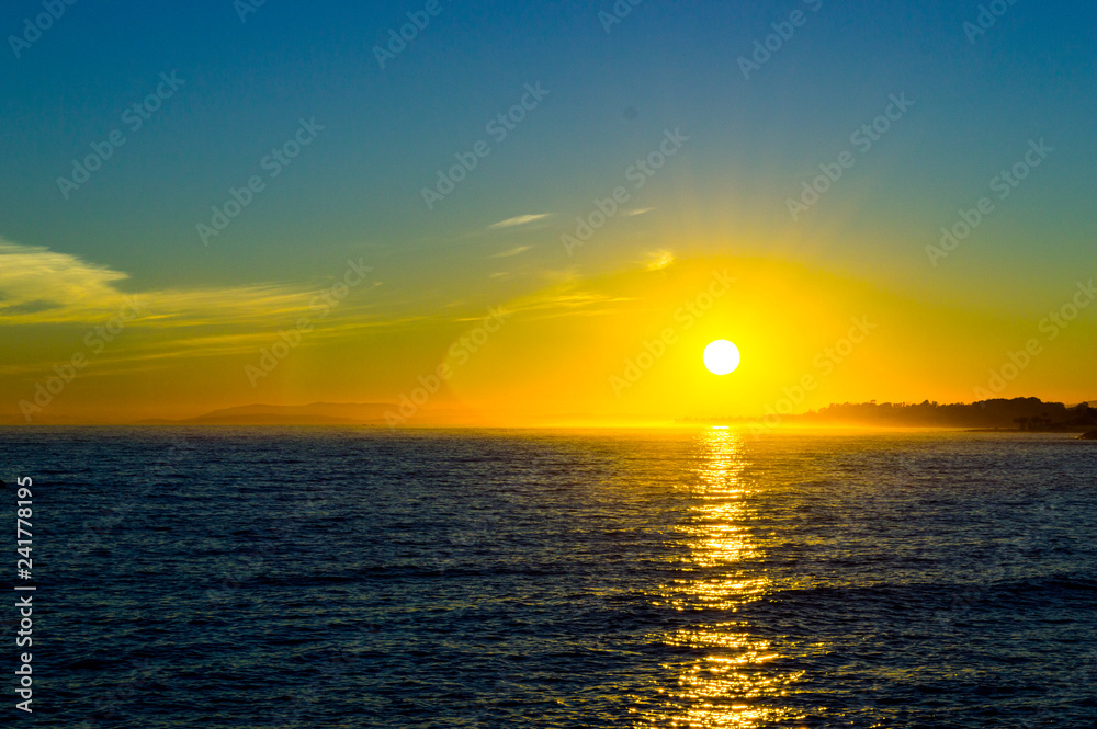 yellow fog in a sunset in the sea of Marbella spain