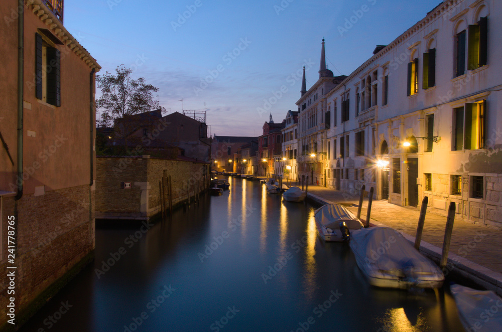 Dawn over a Canal in Venice Italy