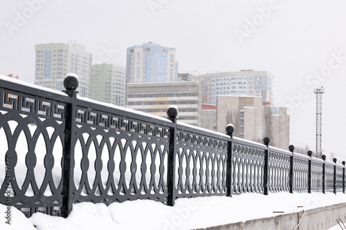 Winter in big city under snowfall