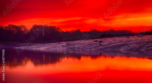 A beautiful landscape shot of a river at sunset a low tide with river bed exposed