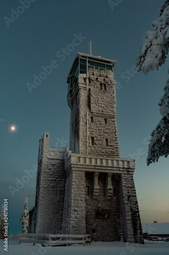 Hornisgrindeturm im Winter bei Mondschein photo