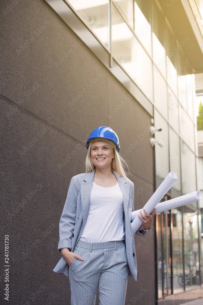 Woman with rolls of blueprints. Woman with rolls of blueprints.