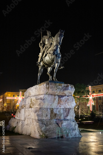 Tirana, Albania - december 31 2018:  night view of the Skanderbeg square with statue of George Castriot (Skanderbeg) photo