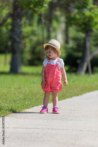 little girl runing in the summer Park © .shock