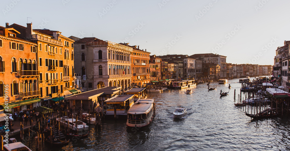 Famous grand canal from Rialto Bridge on sunset in Venice, Italy