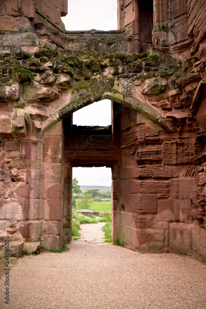 Entrance door on ancient medieval castle with view to outside