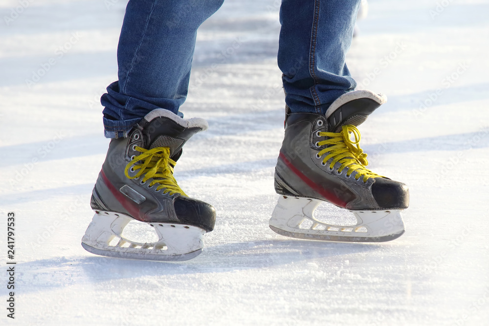 Feet skating on the ice rink Feet skating on the ice rink