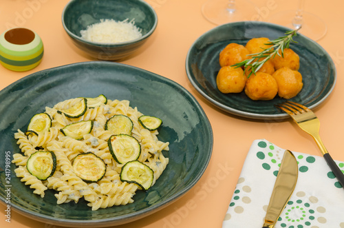 Creamy zucchini pasta with gorgonzola sauce. Delicious healthy Italian food. Pasta fusilli with gorgonzola sauce and zucchini 