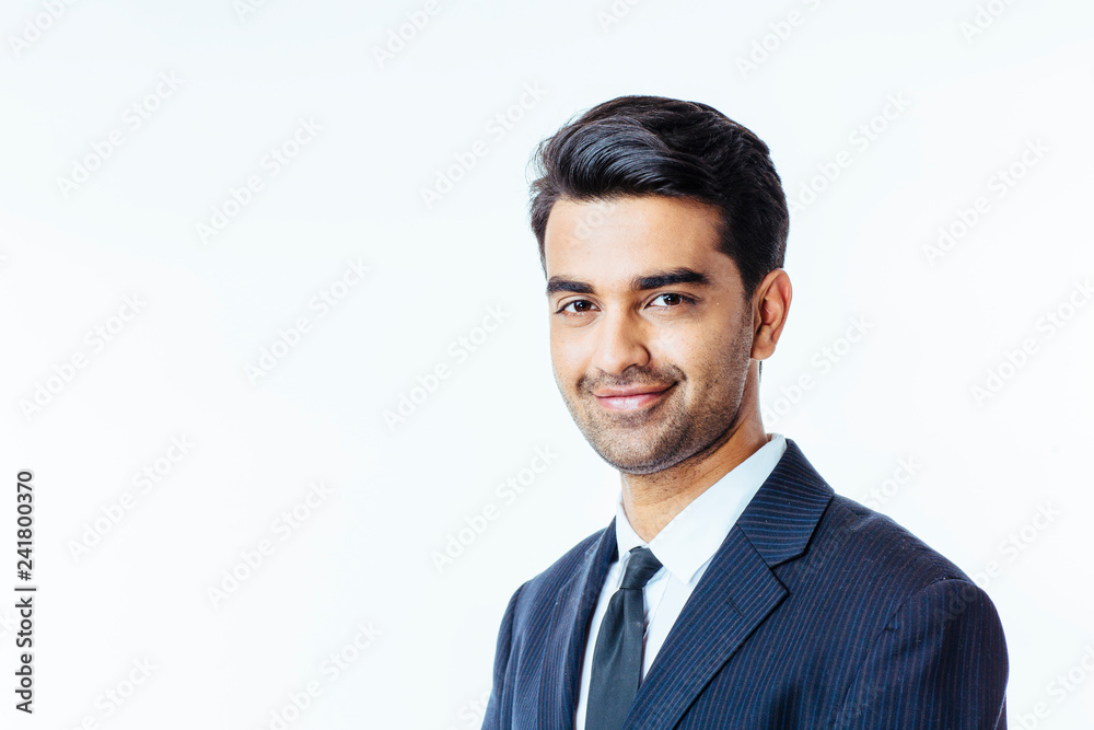 Smiling businessman in suit and tie, isolated on white studio background. Smiling businessman in suit and tie, isolated on white studio background.
